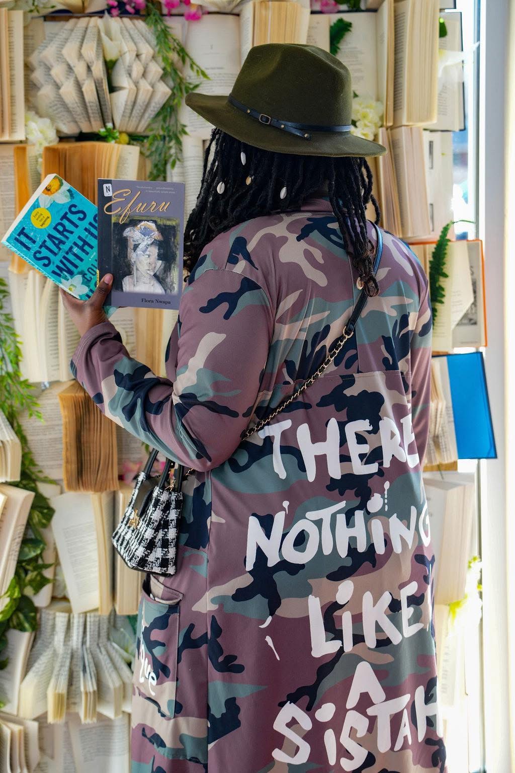 Guest browsing books at a decorated indoor event